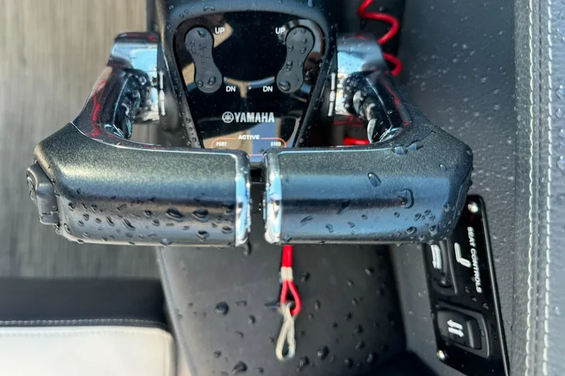 Slide: The Image of Close-up of Yamaha throttle controls on a 2018 Regal 29 OBX boat. - 20