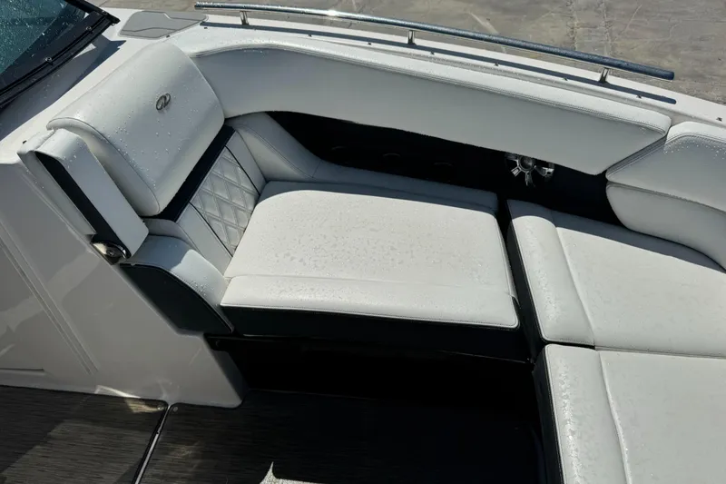Slide: The Image of Luxurious seating on 2018 Regal 29 OBX boat with white upholstery. - 24