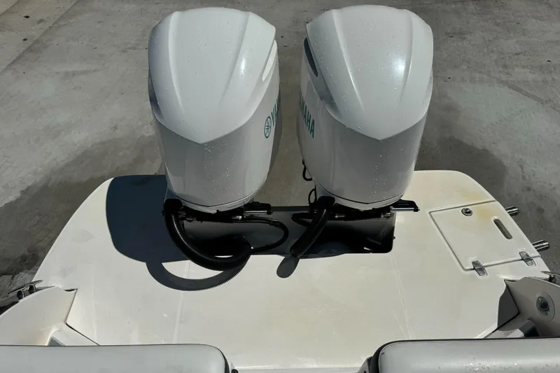 Slide: The Image of 2018 Regal 29 OBX boat with dual outboard engines, viewed from above. - 33