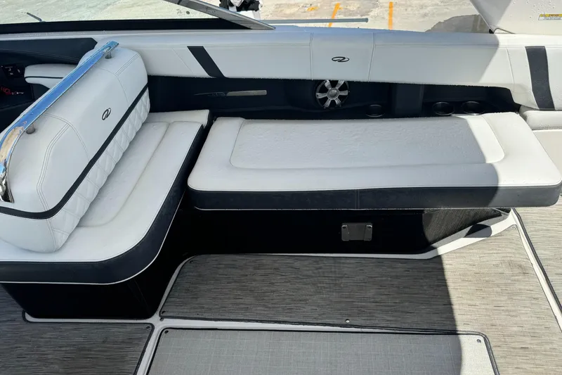 Slide: The Image of 2018 Regal 29 OBX boat interior with white cushioned seating and modern design. - 8