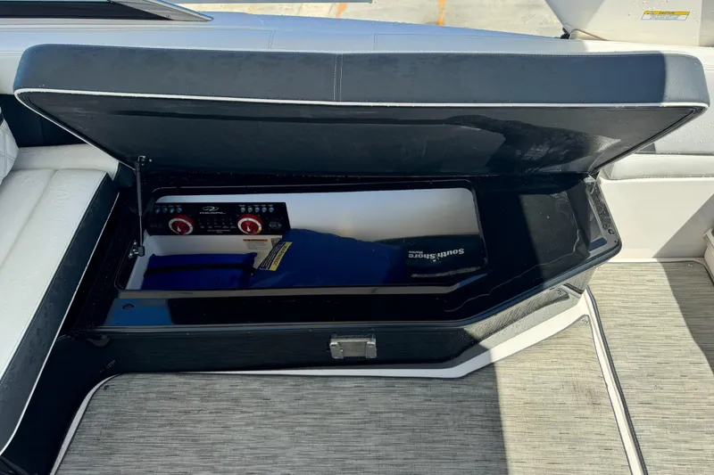 Slide: The Image of Open storage compartment in a 2018 Regal 29 OBX boat interior. - 9