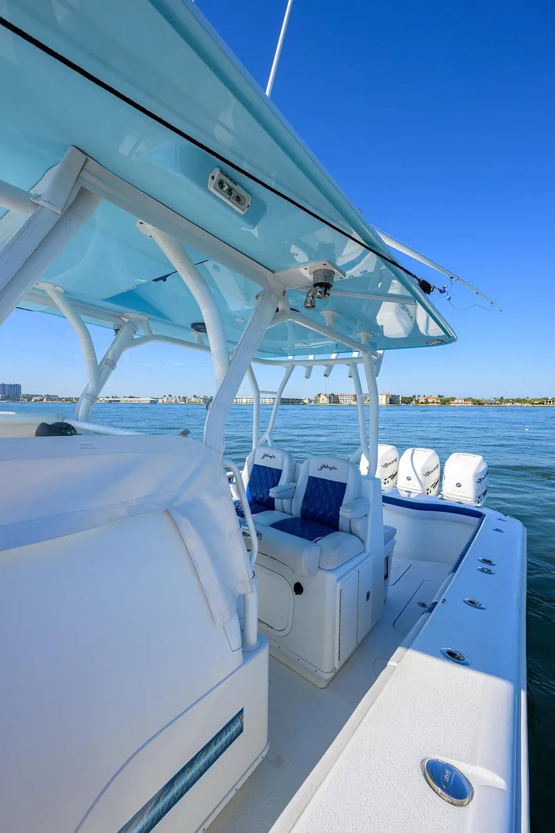 Slide: The Image of 2019 Yellowfin 34 Center Console boat on water, showcasing sleek design and spacious deck. - 11