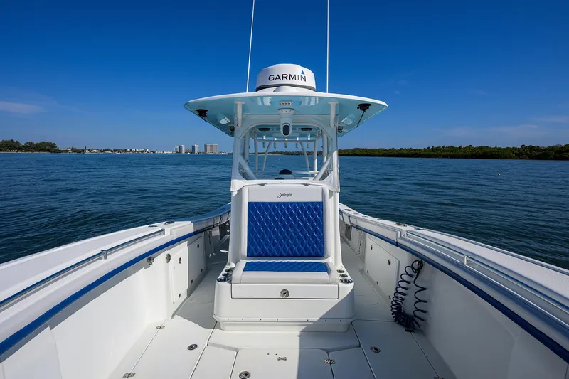 Slide: The Image of 2019 Yellowfin 34 Center Console boat on calm water, featuring a Garmin system. - 15