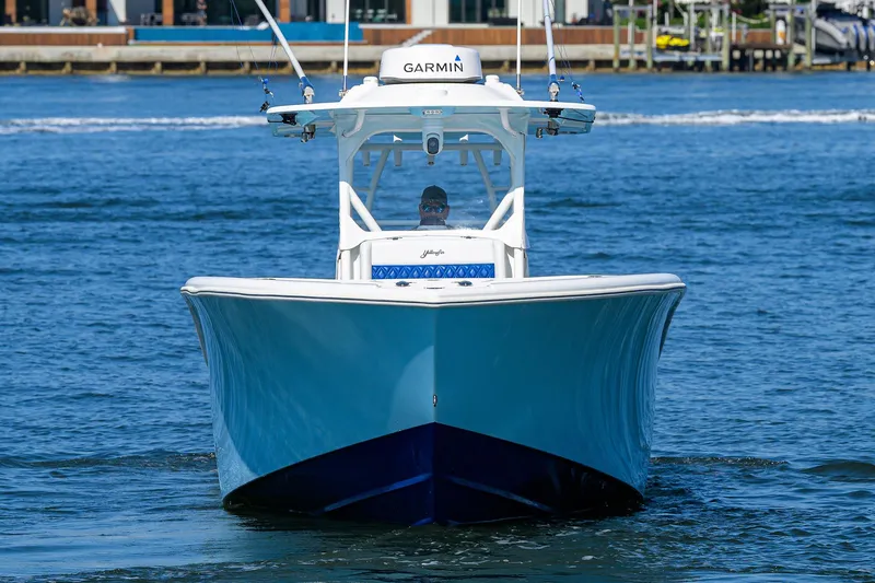 Slide: The Image of 2019 Yellowfin 34 Center Console boat on water, front view. - 2