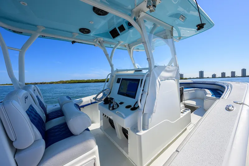 Slide: The Image of 2019 Yellowfin 34 Center Console boat interior with modern navigation system on open water. - 24