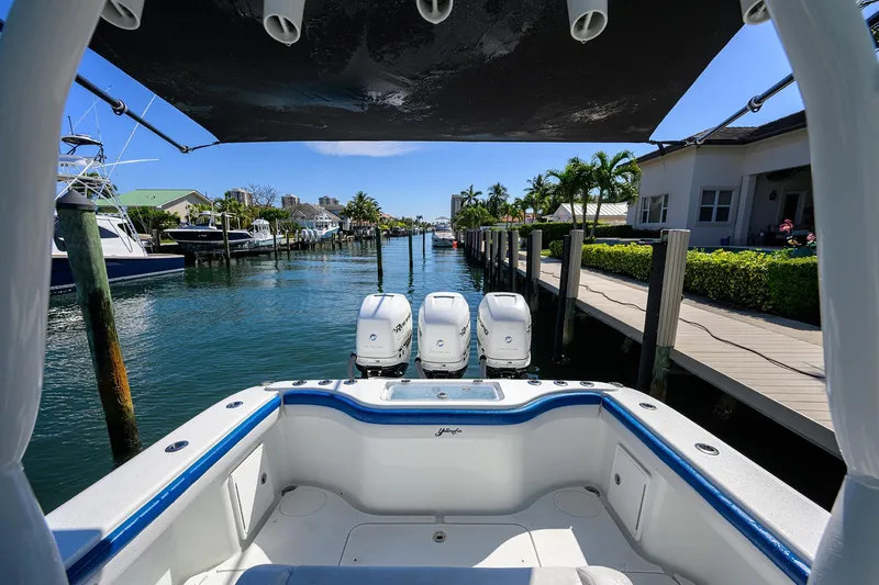 Slide: The Image of 2019 Yellowfin 34 Center Console boat docked in a sunny marina. - 27