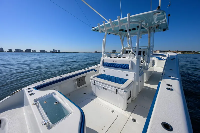 Slide: The Image of 2019 Yellowfin 34 Center Console boat on calm water, featuring spacious deck and seating. - 28
