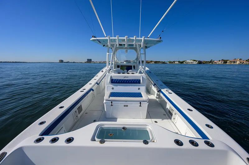 Slide: The Image of 2019 Yellowfin 34 Center Console boat on calm water, clear blue sky. - 29