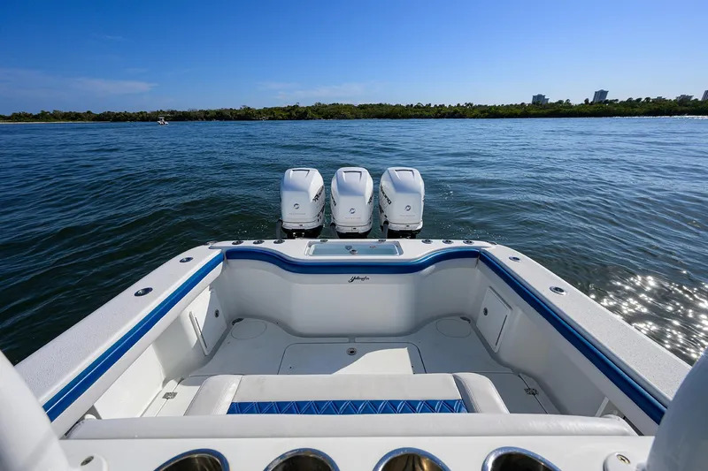 Slide: The Image of 2019 Yellowfin 34 Center Console boat with triple engines on open water. - 30