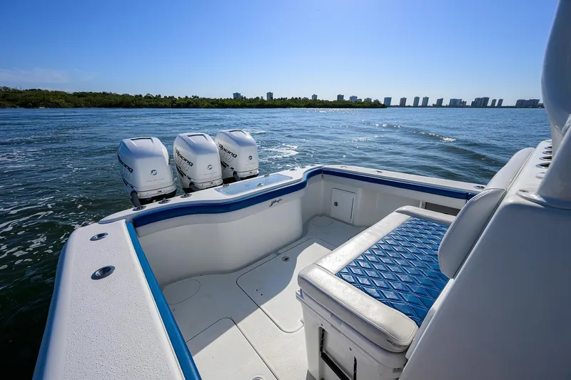 Slide: The Image of 2019 Yellowfin 34 Center Console boat with triple engines on a sunny day. - 31