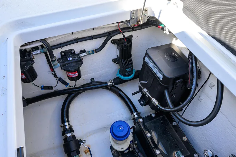 Slide: The Image of 2019 Yellowfin 34 Center Console boat engine compartment with wiring and components. - 33