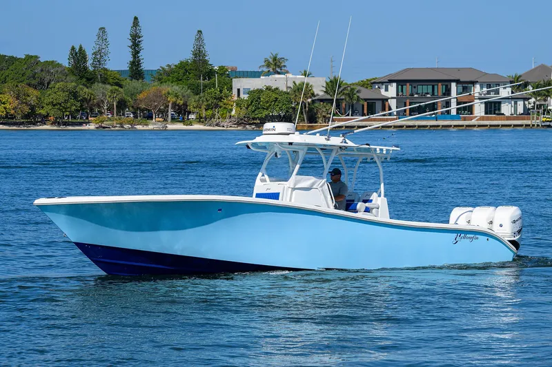 Slide: The Image of 2019 Yellowfin 34 Center Console boat on calm blue water. - 36