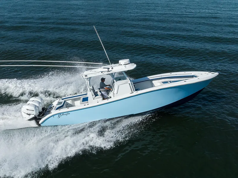 Slide: The Image of 2019 Yellowfin 34 Center Console boat cruising on open water. - 4