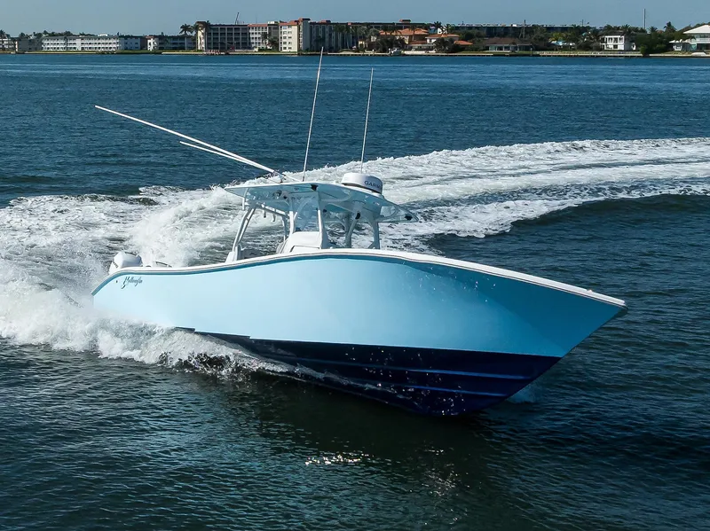 Slide: The Image of 2019 Yellowfin 34 Center Console boat cruising on open water. - 5