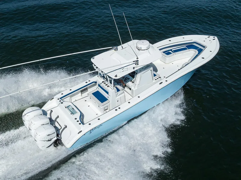 Slide: The Image of 2019 Yellowfin 34 Center Console boat cruising on open water. - 6