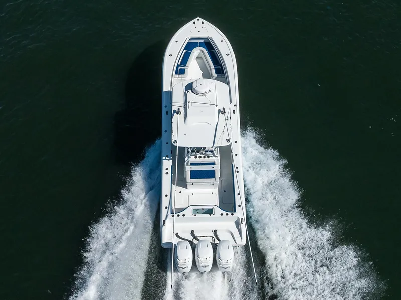 Slide: The Image of 2019 Yellowfin 34 Center Console boat cruising on open water. - 7