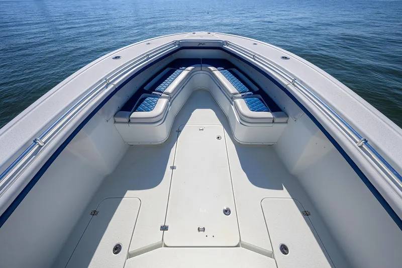 Slide: The Image of 2019 Yellowfin 34 Center Console boat with spacious seating on calm water. - 9