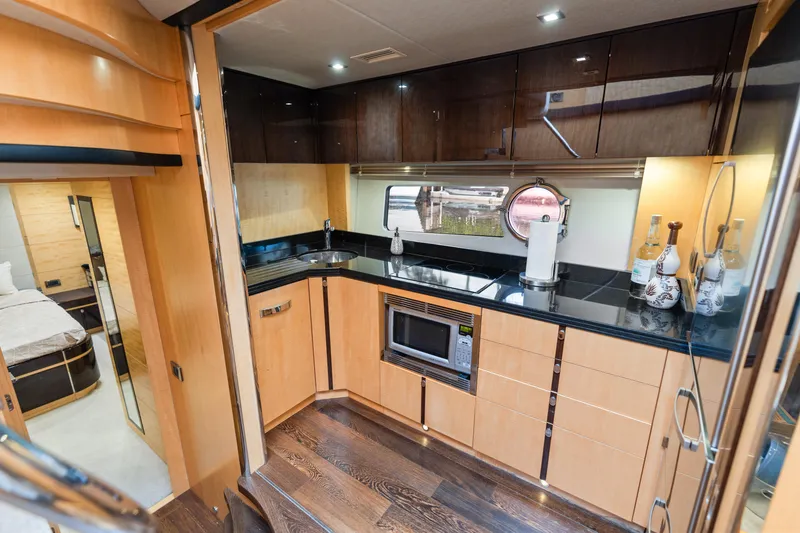 Slide: The Image of Luxurious interior of 2014 Sunseeker 68 Sport Yacht with elegant seating and ocean view. - 10