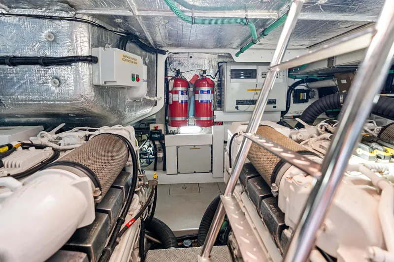 Slide: The Image of Interior of 2014 Sunseeker 68 Sport Yacht, featuring modern kitchen and elegant wood finishes. - 23