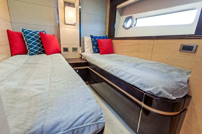 Slide: The Image of Interior cabin of 2014 Sunseeker 68 Sport Yacht with twin beds and colorful pillows. - 29