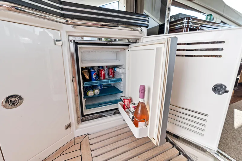 Slide: The Image of Mini fridge stocked with drinks on a 2014 Sunseeker 68 Sport Yacht. - 37