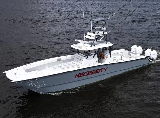 The Image of Freeman 42LR 2018 boat named "Necessity" cruising on water. - 1