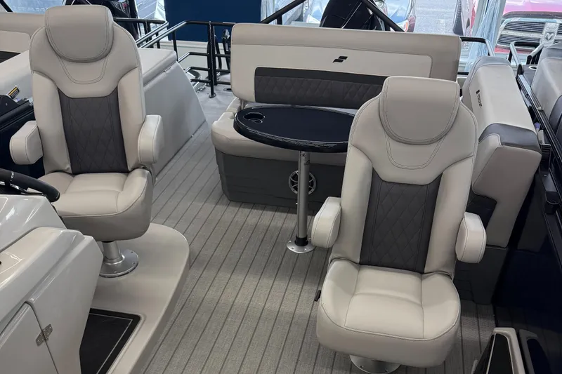 Slide: The Image of 2025 Starcraft SLS 3 Q DH boat interior with plush seating and sleek design. - 4