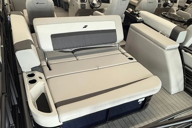 Slide: The Image of 2025 Starcraft SLS 3 Q DH boat interior with luxurious seating and cup holders. - 6