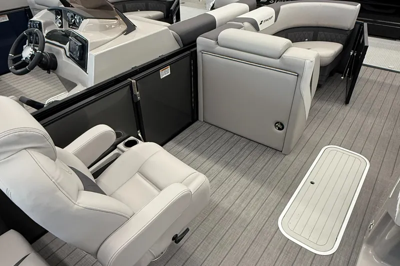 Slide: The Image of 2025 Starcraft SLS 3 Q DH boat interior with plush seating and modern dashboard. - 10