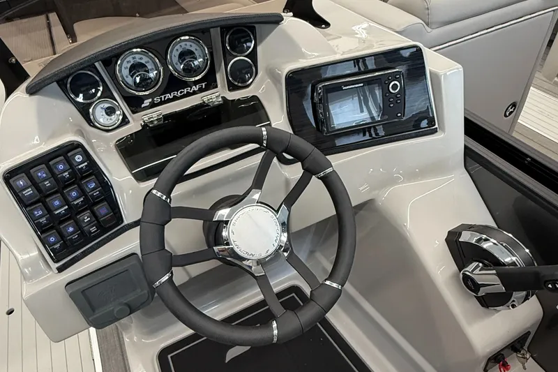 Slide: The Image of Cockpit of 2025 Starcraft SLS 3 Q DH boat with steering wheel and control panel. - 11