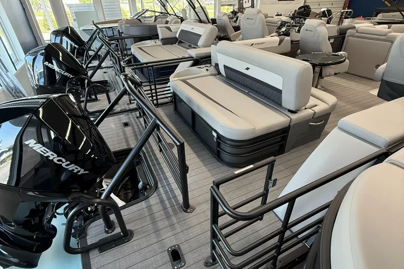 Slide: The Image of 2025 Starcraft SLS 3 Q DH pontoon boat interior with Mercury engines, featuring spacious seating. - 16