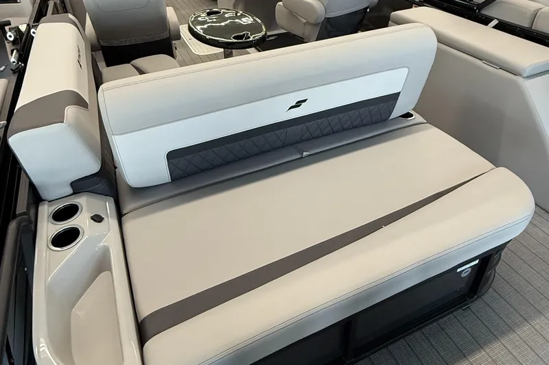 Slide: The Image of 2025 Starcraft SLS 3 Q DH boat interior with cushioned seating and cup holders. - 5