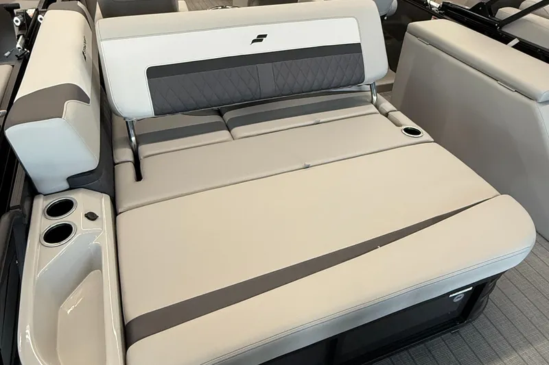 Slide: The Image of 2025 Starcraft SLS 3 Q DH boat interior with beige seating and cup holders. - 6