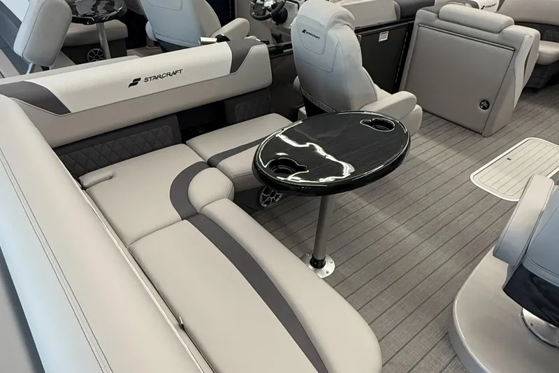 Slide: The Image of Luxurious 2025 Starcraft SLS 3 Q DH boat interior with sleek seating and modern table design. - 8