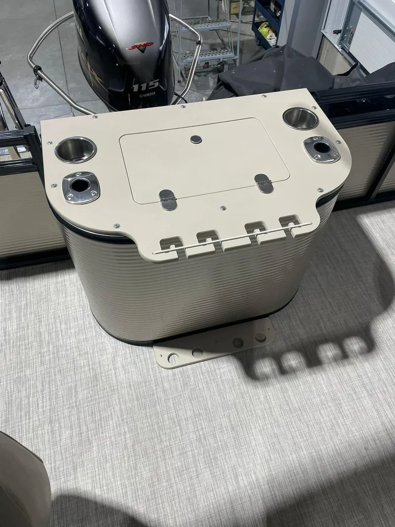 Slide: The Image of 2019 Avalon Lsz Rear Fish 24' boat deck with storage compartment and cup holders. - 12