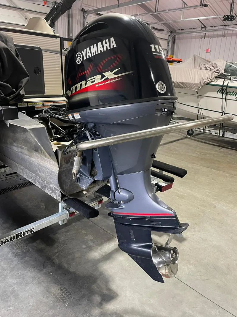 Slide: The Image of 2019 Avalon Lsz Rear Fish 24' with Yamaha VMAX 115 outboard motor in a garage. - 5
