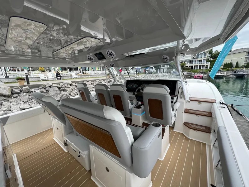 Slide: The Image of Luxurious interior of 2026 Regal 50 SAV yacht with modern seating and dashboard. - 12