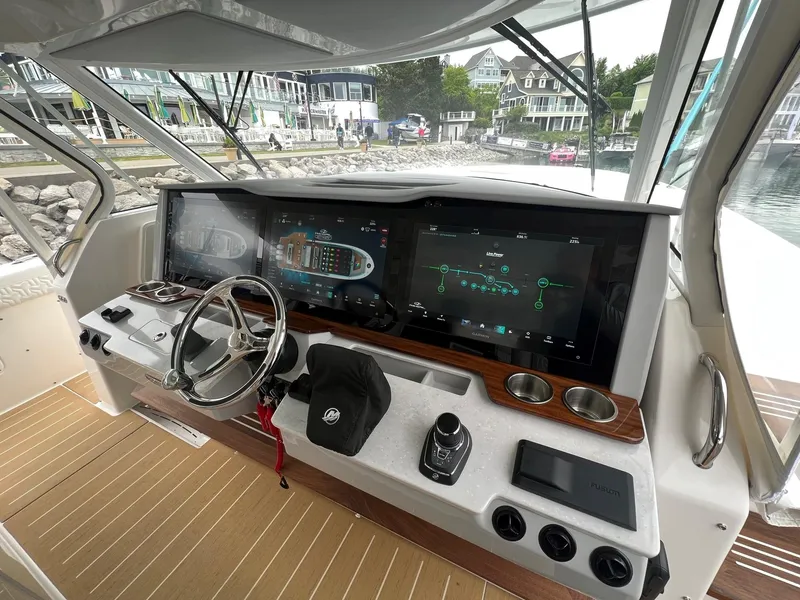 Slide: The Image of Helm of 2026 Regal 50 SAV yacht with advanced navigation displays. - 16