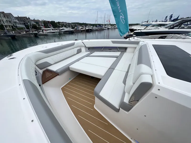 Slide: The Image of Luxurious seating area on 2026 Regal 50 SAV yacht, docked in a scenic marina. - 19