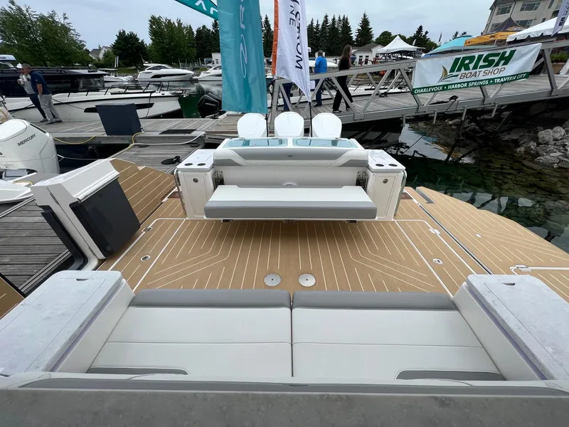 Slide: The Image of 2026 Regal 50 SAV luxury boat at dock with seating and deck view. - 4