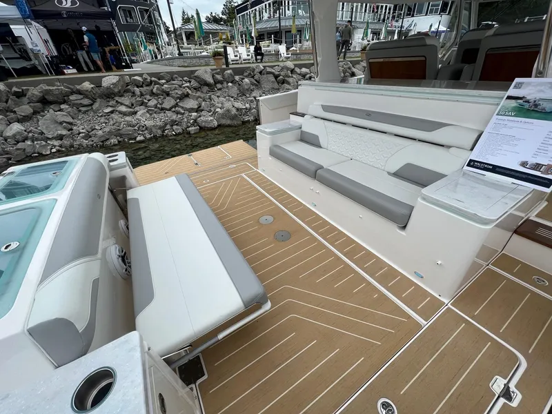 Slide: The Image of 2026 Regal 50 SAV boat interior with luxurious seating and teak flooring. - 7