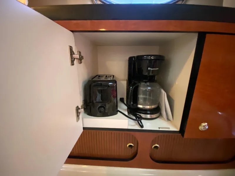 Slide: The Image of Cabinet in 2003 Sea Ray 340 Sundancer with toaster and coffee maker. - 22