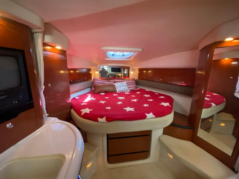 Slide: The Image of Luxurious 2003 Sea Ray 340 Sundancer cabin with cozy bed and elegant interior. - 24