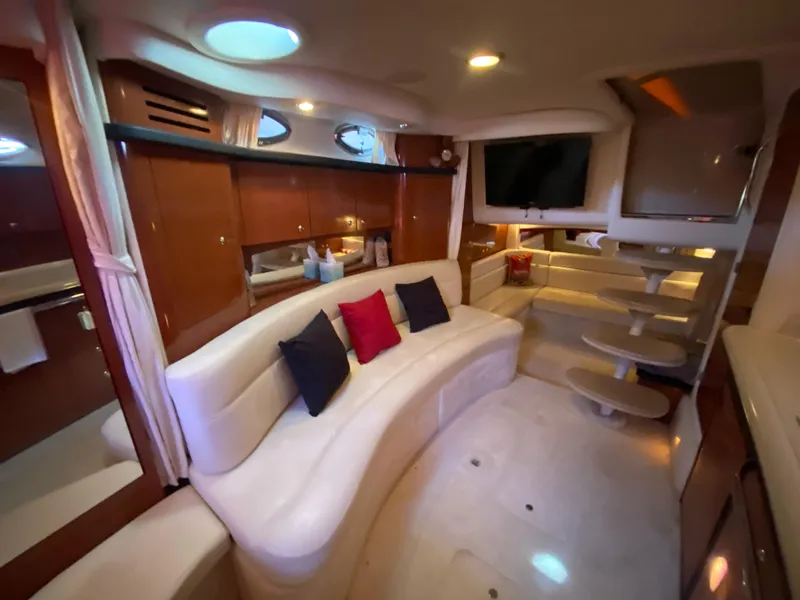 Slide: The Image of Luxurious interior of 2003 Sea Ray 340 Sundancer yacht with plush seating and modern amenities. - 25