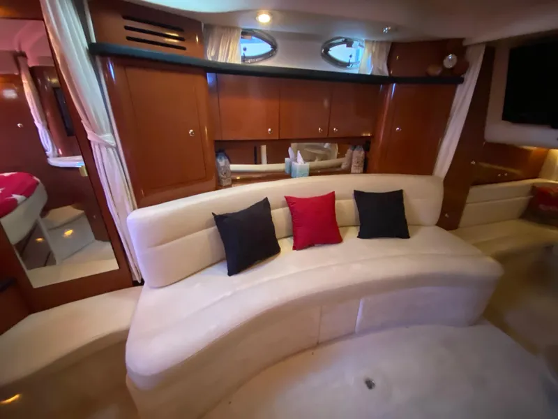 Slide: The Image of Luxurious interior of 2003 Sea Ray 340 Sundancer with plush seating and elegant decor. - 26