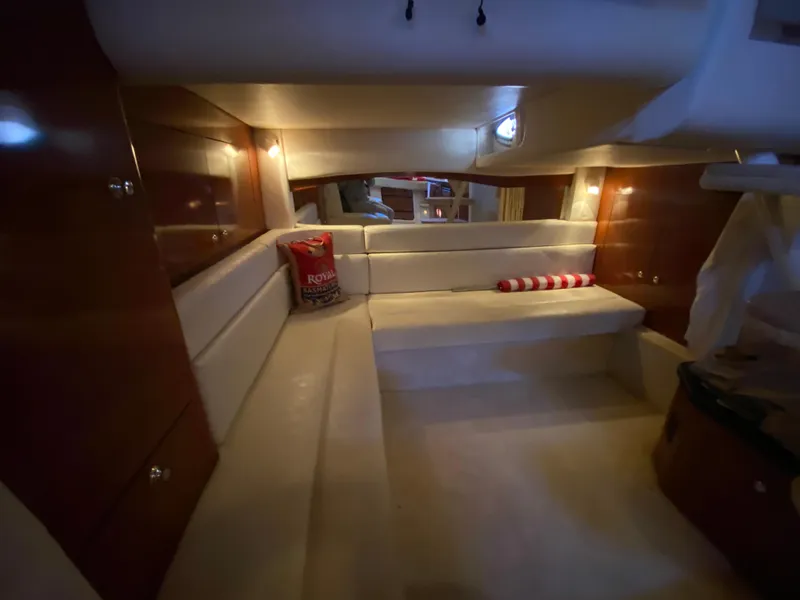 Slide: The Image of 2003 Sea Ray 340 Sundancer cabin interior with seating and ambient lighting. - 27