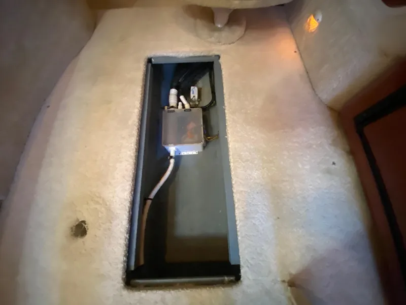 Slide: The Image of 2003 Sea Ray 340 Sundancer interior wiring compartment with cables and connectors. - 33