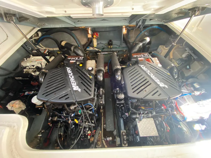 Slide: The Image of Engine compartment of 2003 Sea Ray 340 Sundancer with twin Mercury engines. - 34