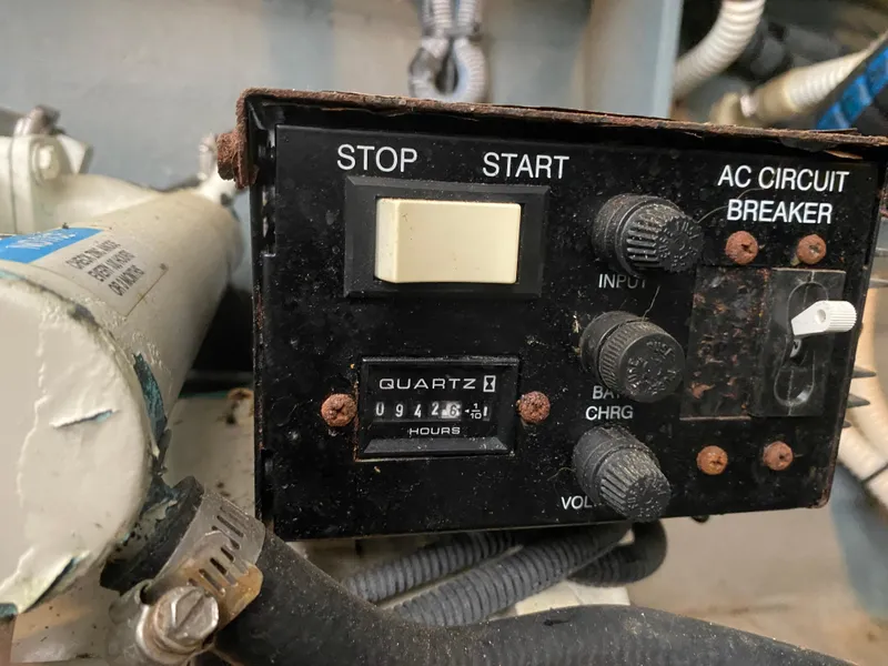 Slide: The Image of Control panel of a 2003 Sea Ray 340 Sundancer boat with hour meter and circuit breaker. - 35