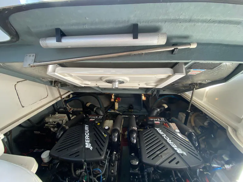 Slide: The Image of Engine compartment of 2003 Sea Ray 340 Sundancer with twin Mercury engines. - 36